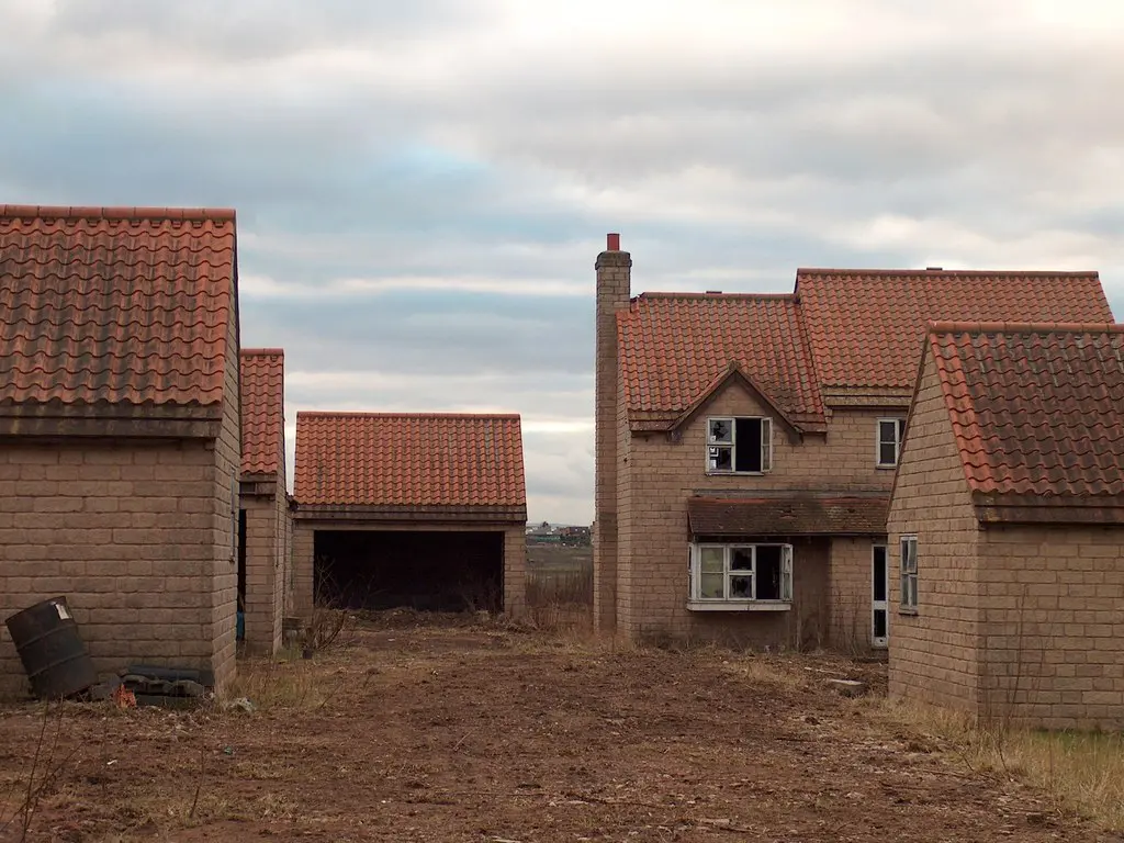 Not all derelict properties for sale are old buildings or ruins. Photo © Neil Theasby (cc-by-sa/2.0)