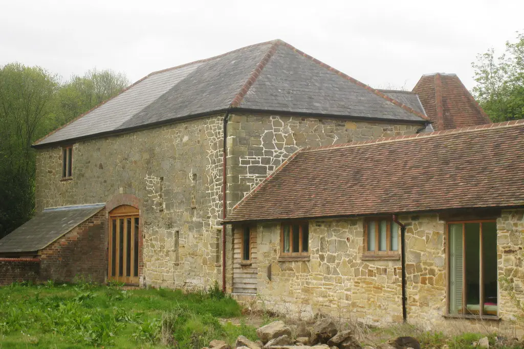 Image showing a renovated derelict barn with land