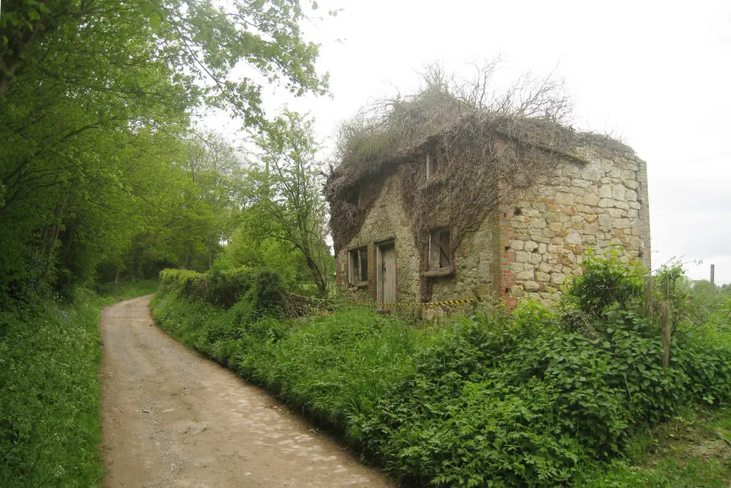 Image showing a rundown house with land 